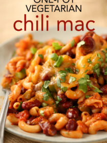 A plate of vegetarian chili macaroni with a fork. The text reads, "one-pot vegetarian chili mac"