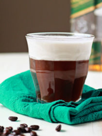 Vegan Irish Coffee recipe - Creamy coconut whipped cream floats dreamily atop spiked whiskey-spiked coffee for this vegan version of the classic cocktail.