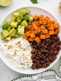 vegetarian cottage cheese bowls with limes and cilantro in the background