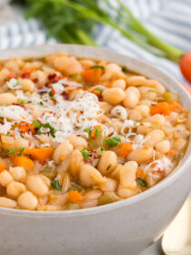 White bowl full of Vegetarian Navy Bean Soup