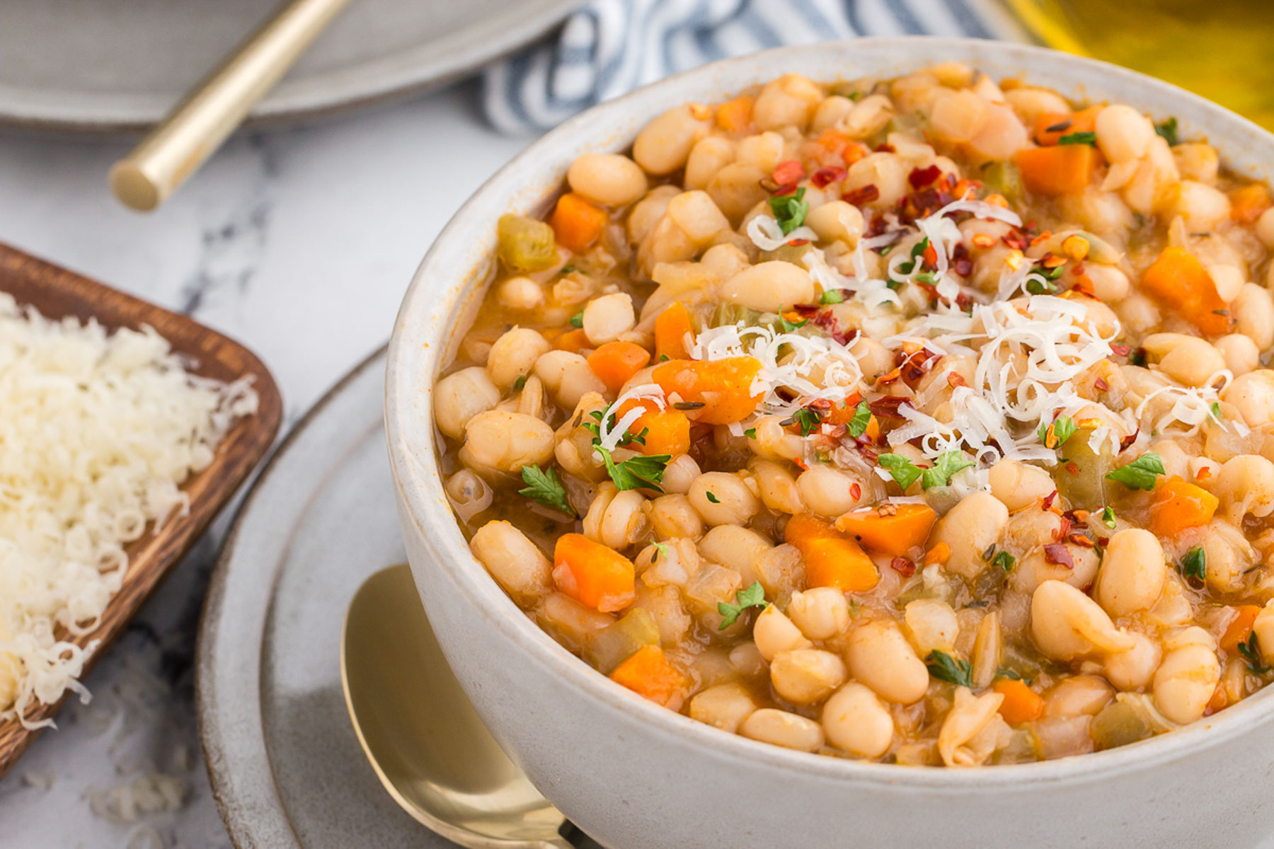 White bowl full of Vegetarian Navy Bean Soup