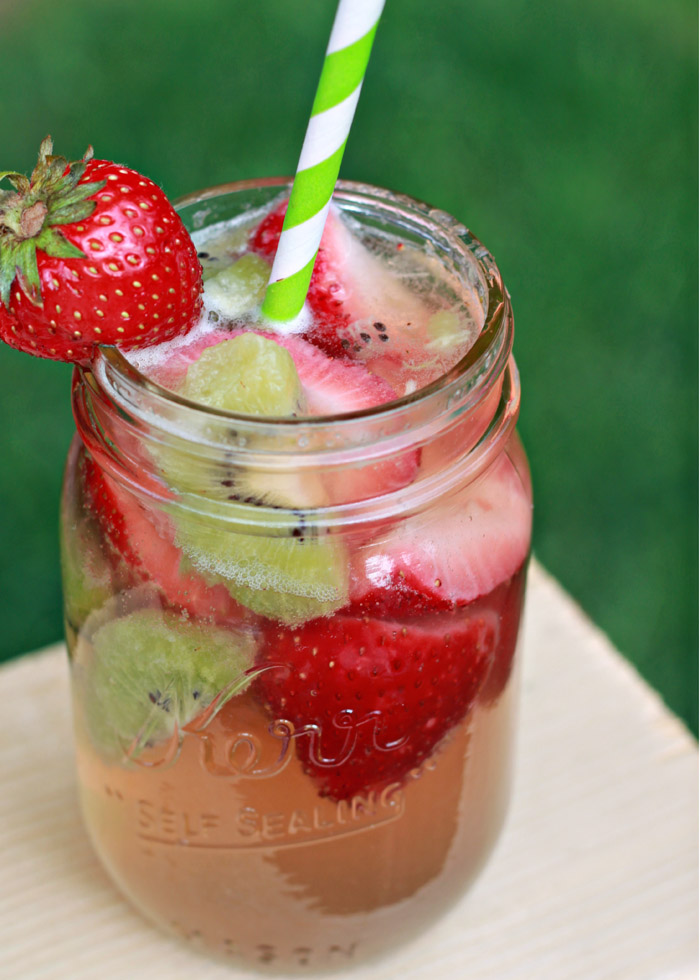 Strawberry-Kiwi White Sangria recipe! Love this refreshing pink summer sangria.