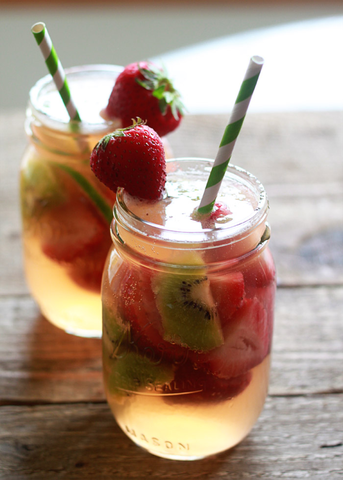 Strawberry-Kiwi White Sangria recipe! Love this refreshing pink summer sangria.