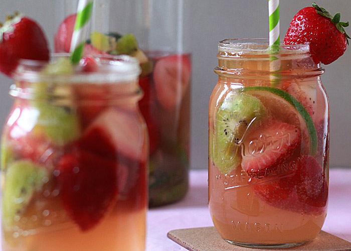 Strawberry-Kiwi White Sangria recipe! Love this refreshing pink summer sangria.